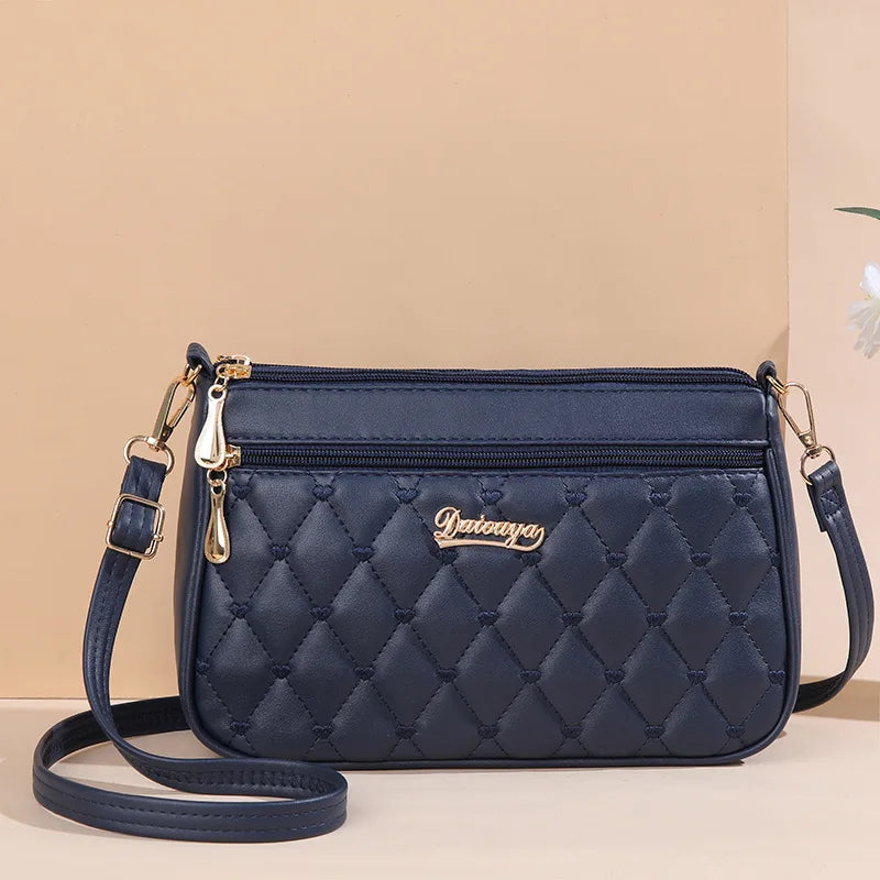 Embroidered Leather Messenger Bag for Women | Stylish Ladies Crossbody Handbag with Hair Ball Charm