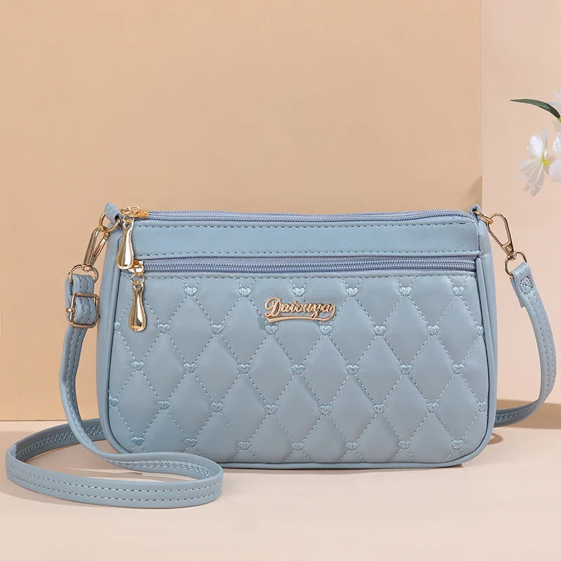 Embroidered Leather Messenger Bag for Women | Stylish Ladies Crossbody Handbag with Hair Ball Charm
